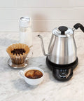 Gooseneck Electric Kettle For Pour Over Coffee And Tea With Dialed In Temperature In One Degree Increments From 104 To 212 Fahrenheit And 40 To 100 Celsius Built In Brew Timer Stainless Steel 1 Liter on kitchen counter