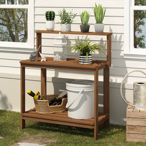 Tioman Outdoor Potting Bench In Natural Hardwood For Small Patios And Balconies With A Tall Open Frame And Slatted Shelves That Drain Water Big On Workspace And Handy Storage For Tools And Plants in a garden setting