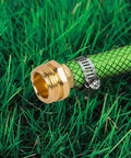 Garden Hose Repair Connector Kit With Clamps For 3/4 Or 5/8 Inch Hoses Male And Female Adapters Aluminum Connectors And Stainless Steel Clamps 5 Sets Plus 5 Extra Washers Quick No Fuss Leak Free Fix For Your Garden Hose, green hose in grass with aluminum connector and clamp visible