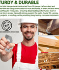 Worker holding 30 Pack 2x4 Joist Hangers And Rafter Brackets Built From 20 Gauge Carbon Steel With Hot Dip Galvanized Finish