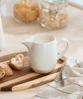 13oz Creamer With Handle Ceramic Pitcher For Coffee, Milk, Syrup And Sauce, Multipurpose Stoneware Jug on a kitchen counter