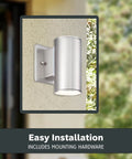 Sleek Six Inch LED Outdoor Wall Sconce For Front Door And Wraparound Porch Bringing Darn Bright Integrated Bulb Free Illumination In Smooth Satin Platinum mounted on a wall.