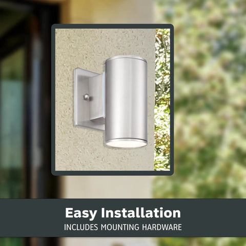 Sleek Six Inch LED Outdoor Wall Sconce For Front Door And Wraparound Porch Bringing Darn Bright Integrated Bulb Free Illumination In Smooth Satin Platinum mounted on a wall.