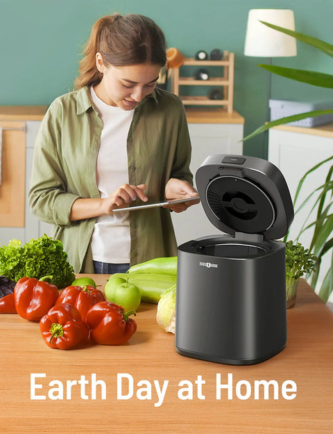 Woman using Electric Kitchen Compost Bin For Indoor Countertop With 3 Modes, Odor Free Carbon Filter System, Eco Friendly Smart Waste Recycler, Converts Food Scraps To Fertilizer For Your Garden, Low Mess on kitchen counter