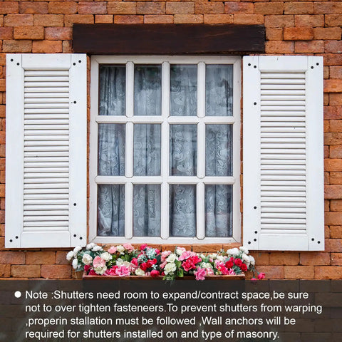 Contractor Grade 3 Inch Vinyl Shutter Fasteners With Reverse Barb Design Sunproof Black Shutter Spike Anchors on a brick wall.