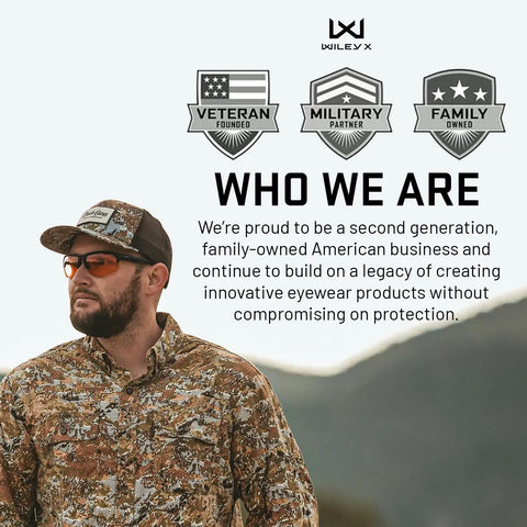Man wearing Badass Tactical Shooting Safety Glasses With Interchangeable Lenses, camouflage shirt, outdoor setting.