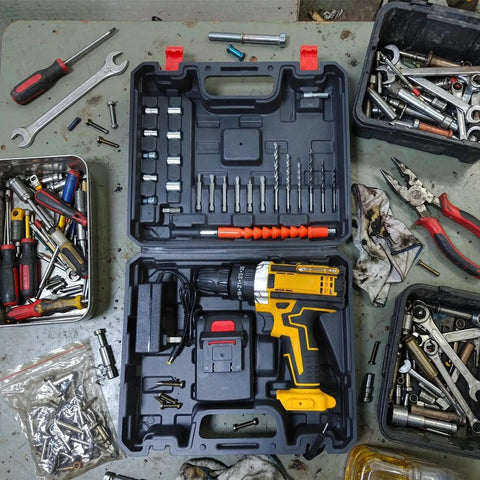 Knockout Performer 21V Cordless Drill And Electric Driver Set With Adjustable Torque in tool case, surrounded by assorted tools and bits.