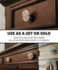 Rock Solid Compass Rose Drawer Pulls Set Of 12 In Antique White Cast Iron Nautical Cabinet Handles on drawer fronts.