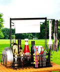 Outdoor Grill Caddy With Paper Towel Holder And Utensil Organizer on picnic table with plates, condiments, and utensils outdoors