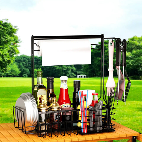 Outdoor Grill Caddy With Paper Towel Holder And Utensil Organizer on picnic table with plates, condiments, and utensils outdoors