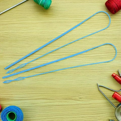 Five Piece Rope Threader Tool Set For Easy Threading And Quick Drawstring Replacement, Handy Lightweight Plastic String Puller For Pants, Shoelaces, Elastic Bands, And Craft Projects On The Go. Blue plastic rope threaders laid flat