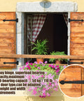 Solid As A Rock 15 Inch Heavy Duty T Strap Hinges 4 Pack With Mounting Fasteners Black Powder Coated Rust Resistant Wrought Iron Barn Door Hardware mounted on wooden shutters.