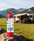 This 2.5 Lb Abc Fire Extinguisher Is A Total Game Changer For Home Garage And Car Safety As The Dry Chemical Formula Handles Grease Electric And Fuel Fires Like A Pro On Boat Or Kitchen Duty, positioned on a stone with a camper in the background.