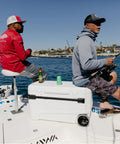 Fishing on a boat with MaxCold Glide 110 Qt Insulated Rolling Cooler with soft ride wheels and telescoping handle.