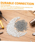 Two Hundred Piece Cabinet Fitting Kit With Rock Solid Self Tapping Screws And Heavy Duty Metal Connectors, screws and connectors on wooden surface.