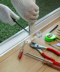 Person installing Rock Solid Heavy Duty Sliding Door Roller featuring dual bearings with tools for closet track replacement.