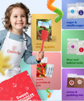 Child holding Dirt Pie Kids Baking Kit with chocolate cake mix, pre-measured dry ingredients, chewy gummy worms, baking tools and guide