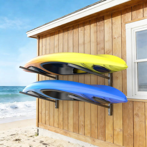 Kickass Heavy Duty Four Tier Kayak Storage Rack With Adjustable Wall Mount For Paddle Gear Organizer Solid Steel Frame Holds Up To Two Hundred Twenty Lbs Per Shelf with two kayaks in blue and yellow on a wall.