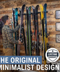 Heavy Duty Wall Mount Ski Rack That Locks Up To Five Pairs Smoothly storing multiple skis on a wooden wall.