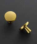 Level Up Your Kitchen Setup With This 25 Pack Of Heavy Duty Brushed Brass Cabinet Knobs Measuring 1-1/4 Inch Round Circle showing two brushed brass round knobs.
