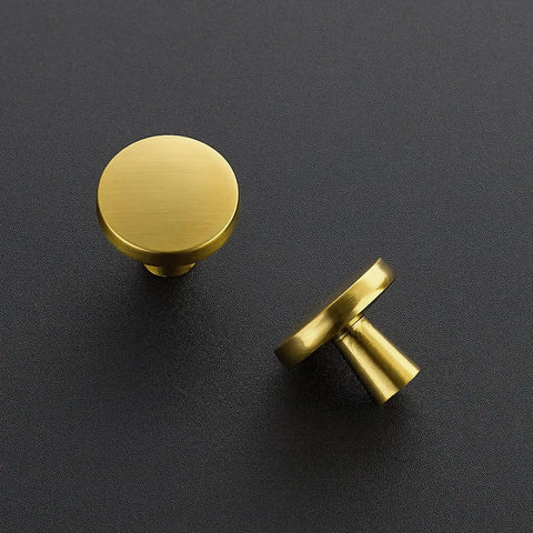 Level Up Your Kitchen Setup With This 25 Pack Of Heavy Duty Brushed Brass Cabinet Knobs Measuring 1-1/4 Inch Round Circle showing two brushed brass round knobs.
