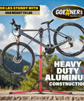Heavy Duty E Bike Repair Stand With 110 Lb Capacity holding bicycle outdoors, aluminum construction, rust resistant clamps visible.