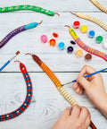 Ten Piece Unfinished Wooden Snakes Craft Kit With Jointed Wiggly Bodies, Includes 12 Color Acrylic Paints And Two Brushes