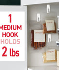 Medium Wire Toggle Hooks Set With Adhesive Strips 35 Hooks And 40 Strips Damage Free Hanging On Smooth Surfaces No Tools Needed Holds Up To 2 Pounds Per Hook So You Can Get Your Space Organized Fast used on kitchen cabinet holding spice bags