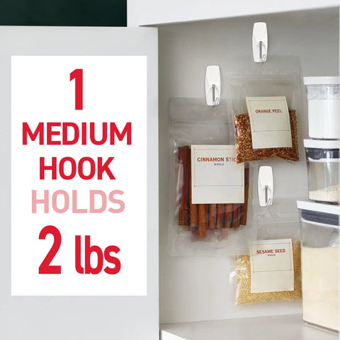 Medium Wire Toggle Hooks Set With Adhesive Strips 35 Hooks And 40 Strips Damage Free Hanging On Smooth Surfaces No Tools Needed Holds Up To 2 Pounds Per Hook So You Can Get Your Space Organized Fast used on kitchen cabinet holding spice bags