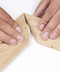 Hands aligning beechwood boards for assembly using Top Shelf Beechwood Joining Biscuits Pack Of One Hundred No Zero Size For Woodworking.