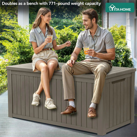 Two people sitting on Massive 220 Gallon Outdoor Storage Deck Box With Divider Waterproof Lockable Resin Built Wood Look Brown.