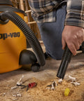 Person using wet/dry vacuum with Pleated Cartridge Filter Replacement for Wet Dry Vacuums, 8 Inch Diameter by 6.5 Inch Height