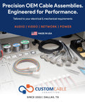 Precision OEM cable assemblies displayed on workbench, showcasing various connectors and wires.