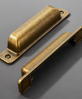 Heavy Duty 10 Pack Of Three Inch Antique Brass Cabinet Pulls With Slick Zinc Alloy Build And Tight Screw Placement For Kitchen Drawers - two pulls shown.