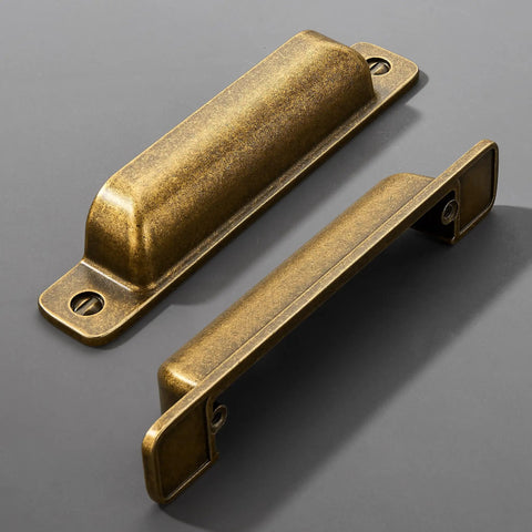 Heavy Duty 10 Pack Of Three Inch Antique Brass Cabinet Pulls With Slick Zinc Alloy Build And Tight Screw Placement For Kitchen Drawers - two pulls shown.