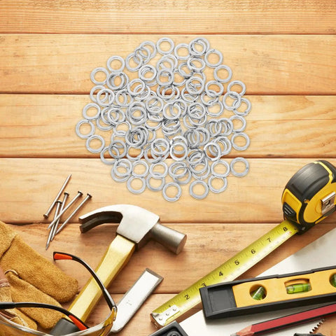 Stainless Steel M8 Spring Lock Washers Set 100 Pieces Split Locking Washers For Screws And Bolts Pro Grade DIY Gear For Industrial And Home Use With Heavy Duty Security And Vibration Resistance, piled with tools