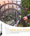 Heavy Duty Spring Loaded Gate Caster Wheels Set Featuring Rust Resistant Black Steel Build And Rock Solid Load Capacity For Hassle Free Swinging On Big Outdoor Property Gates, shown with a decorative gate.