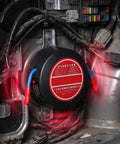 Top Shelf Emergency Essentials For Your Daily Driver Solid Compact Auto Fire Suppressor installed in vehicle with clear wires.