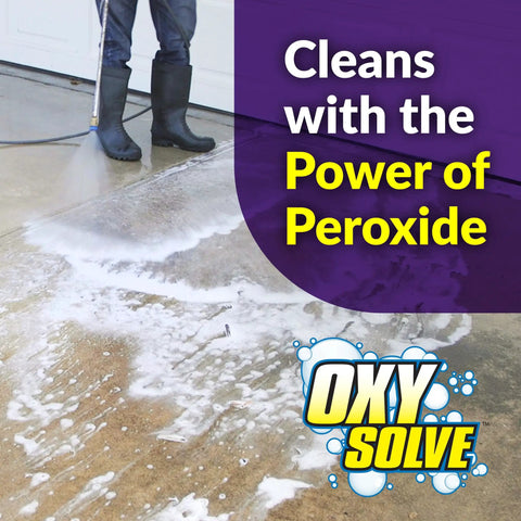 Person using Oxy Solve Concrete And Driveway Pressure Washer Cleaner Purple Unscented 128 Fl Oz Stain Bustin Grime Bustin With Peroxide Power