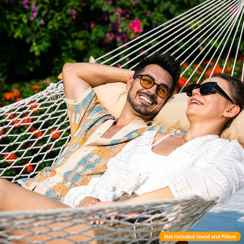 Couple relaxing on a Two Person 12 Ft Double Rope Hammock With Spreader Bar Hand Woven Cotton Outdoor Patio Hammock For Poolside Lounging