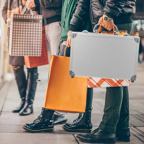 Badass Heavy Duty Aluminum Alloy Tool Box With Reinforced Carry Handle And Secure Latch System For Shop Ready Mechanics And Field Maintenance Portable Storage Case held by shoppers outdoors.