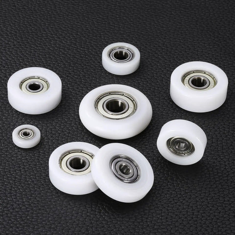 No Sweat Heavy Duty Nylon Ball Bearing Rollers 12 Pack Smooth Operator Idler Pulley Wheels showing various sizes of white nylon rollers with ball bearings.