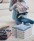 20 Pack Tshirt Organizer Stackable Closet Shelf Storage For Folded Clothes on a rug with shirts neatly organized.