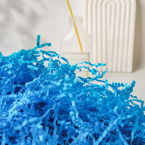 Top Shelf White Crinkle Paper Shreds And Gift Basket Filler No Brainer Cushioning Material For Shipping Boxes And Crafts Killer Value Packing Stuffing Option For Creative Folks in blue shreds.
