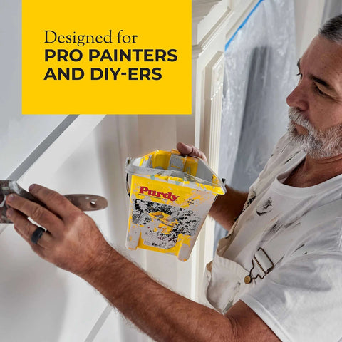 Professional painter using Purdy 140910300 Wire Brushes Block for surface prep, holding Purdy paint tray, designed for pros and DIYers.