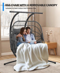 Double Egg Chair With Removable Adjustable Canopy For Outdoor Hangout Patio Balcony And Garden in indoor setting with couple