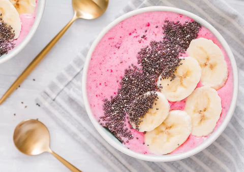 Smoothie bowl made with Organic Freeze Dried Strawberry Powder Bulk 20 Pound Bag Non GMO 100 Percent Pure No Additives Vegan topped with banana slices and chia seeds.