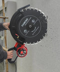 Heavy Duty 16 Inch Electric Concrete Saw With 4000 Watt Copper Motor, user cutting through wall with diamond blade.