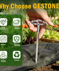 Hand holding heavy duty 8 gauge landscape staple pin for weed barrier fabric installation in garden