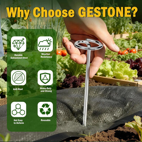 Hand holding heavy duty 8 gauge landscape staple pin for weed barrier fabric installation in garden